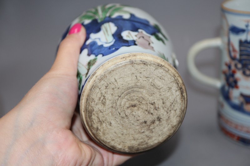 A Chinese famille verte wucai vase, a Chinese blue and white and an Imari mug, tallest 18cm